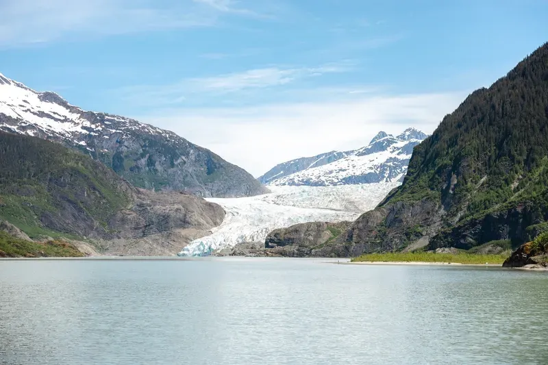 Double-decker whale watching boat with tourists on the top deck during a Mendenhall Glacier day trip from Juneau